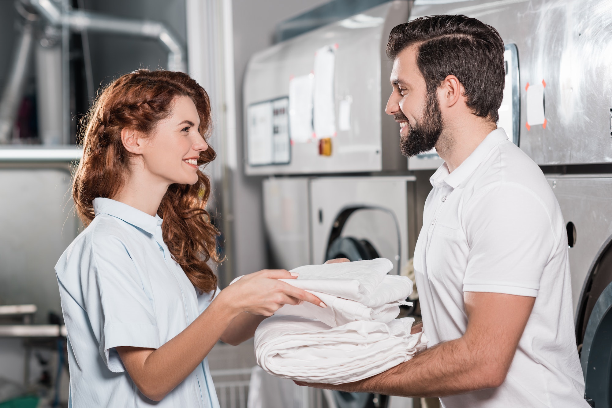 dry cleaning managers working together at laundry